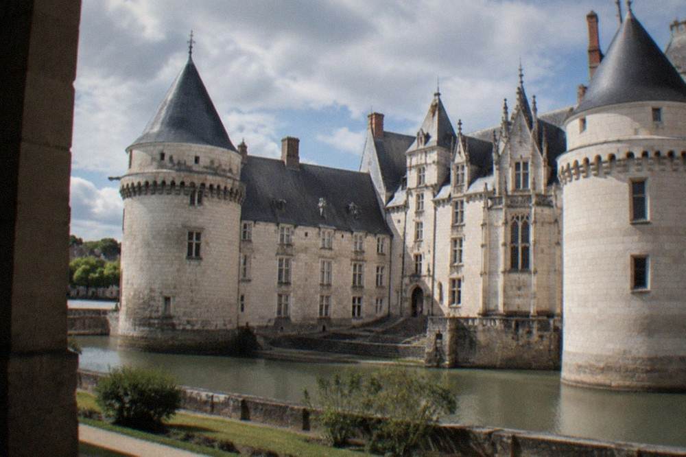 The white stone facade and towers of the Château des ducs de Bretagne on a sunny day