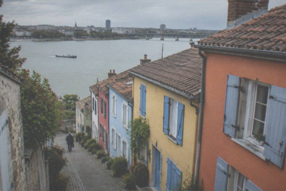 Coloured fishermen's houses on a narrow lane in Trentemoult across the Loire from Nantes