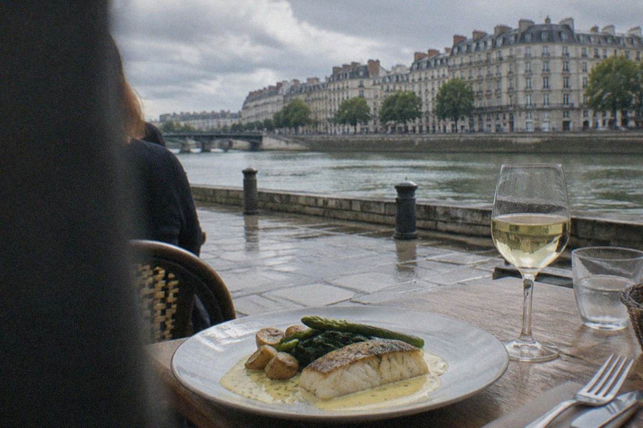 A plated serving of fish with beurre blanc sauce on a restaurant table in Nantes