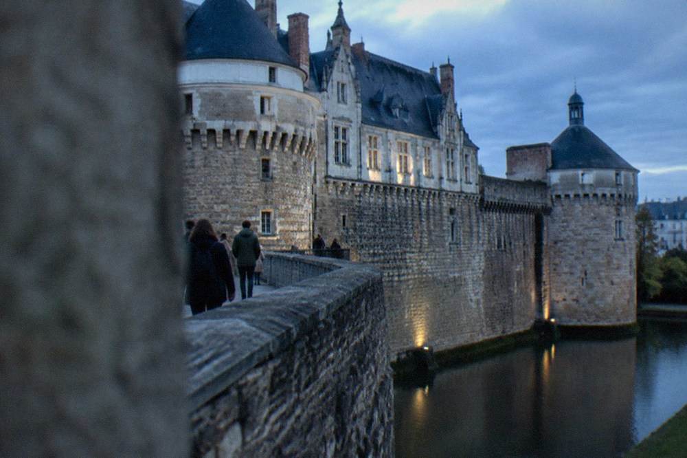 Walkers on the ramparts of the Château des ducs de Bretagne in Nantes