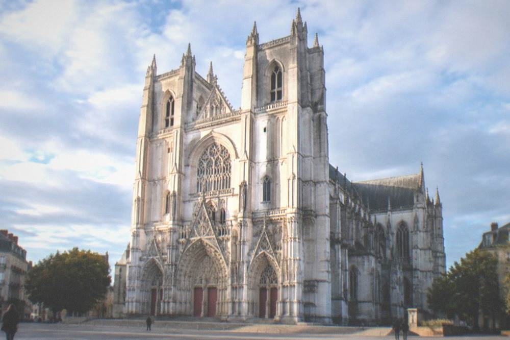 The white stone nave of Nantes cathedral seen from the west end